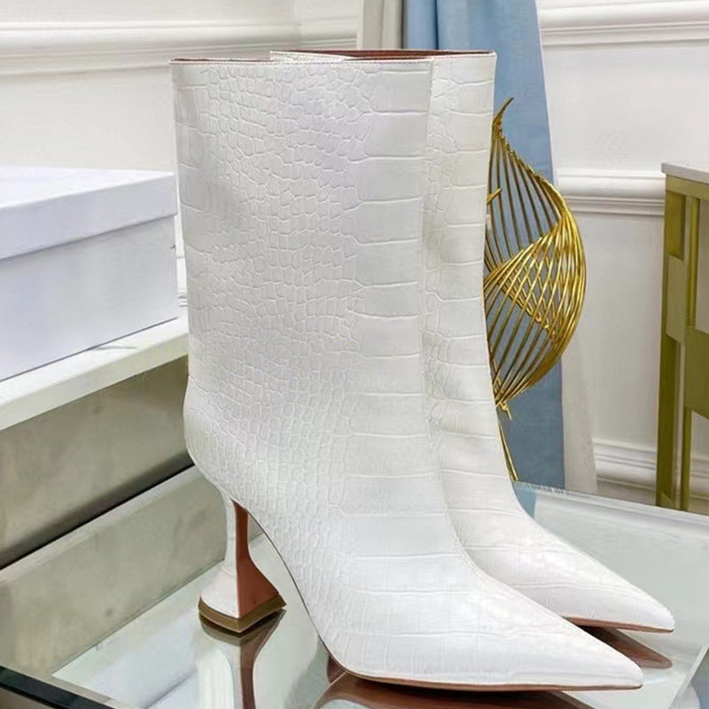 White faux-croc leather mid-calf boots with pointed toes and flared stiletto heels.