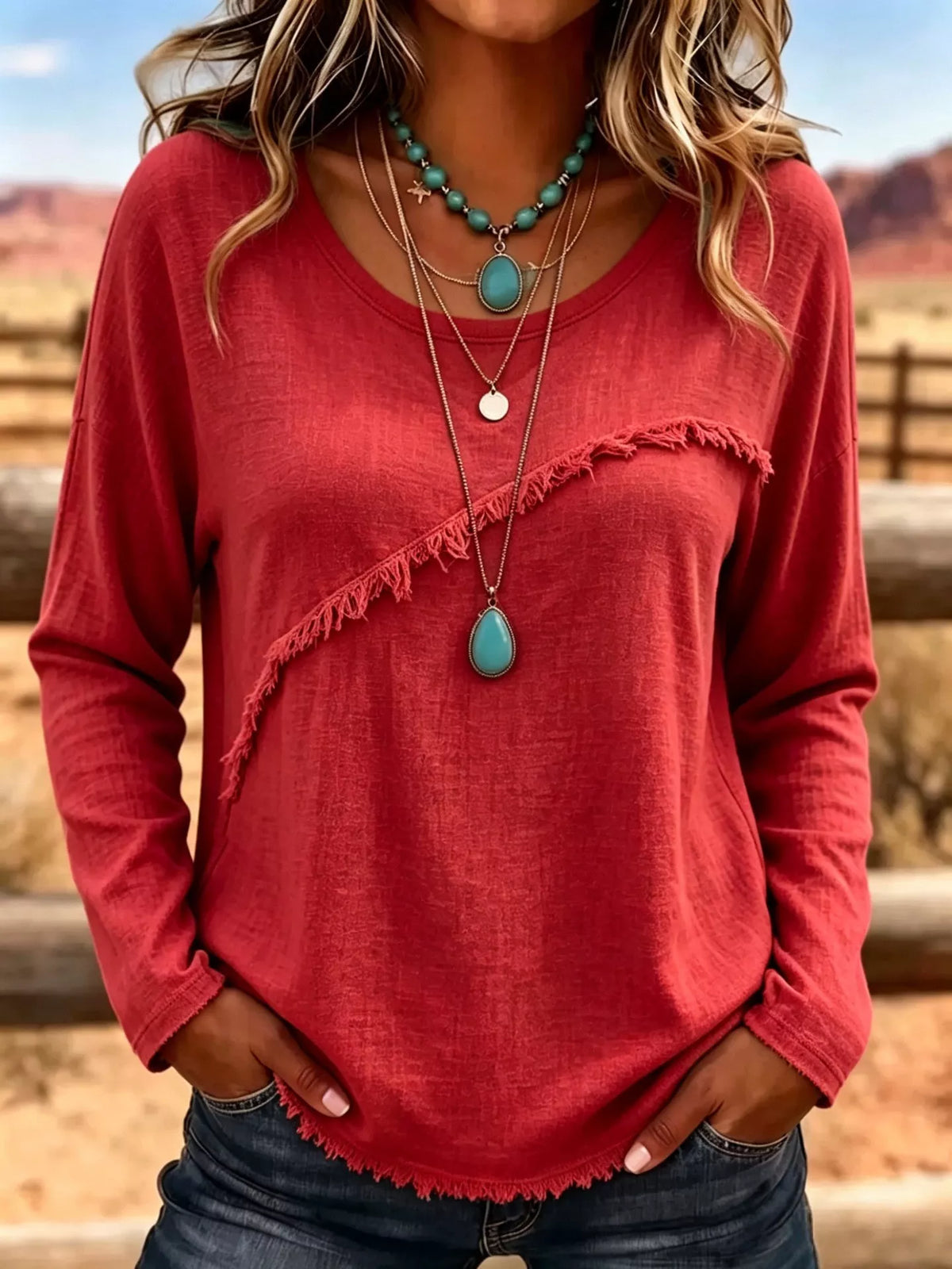 Plus size long sleeve fringe detail T-shirt from Trendsi, showing the black top with decorative fringe on sleeves.