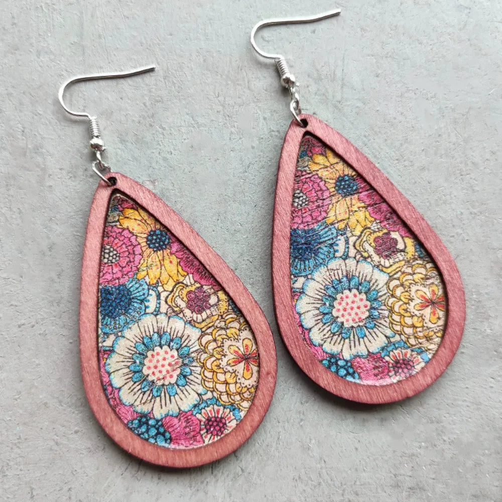 Floral wood teardrop earrings by Plush Fashion Hub featuring natural wood and vibrant floral design.