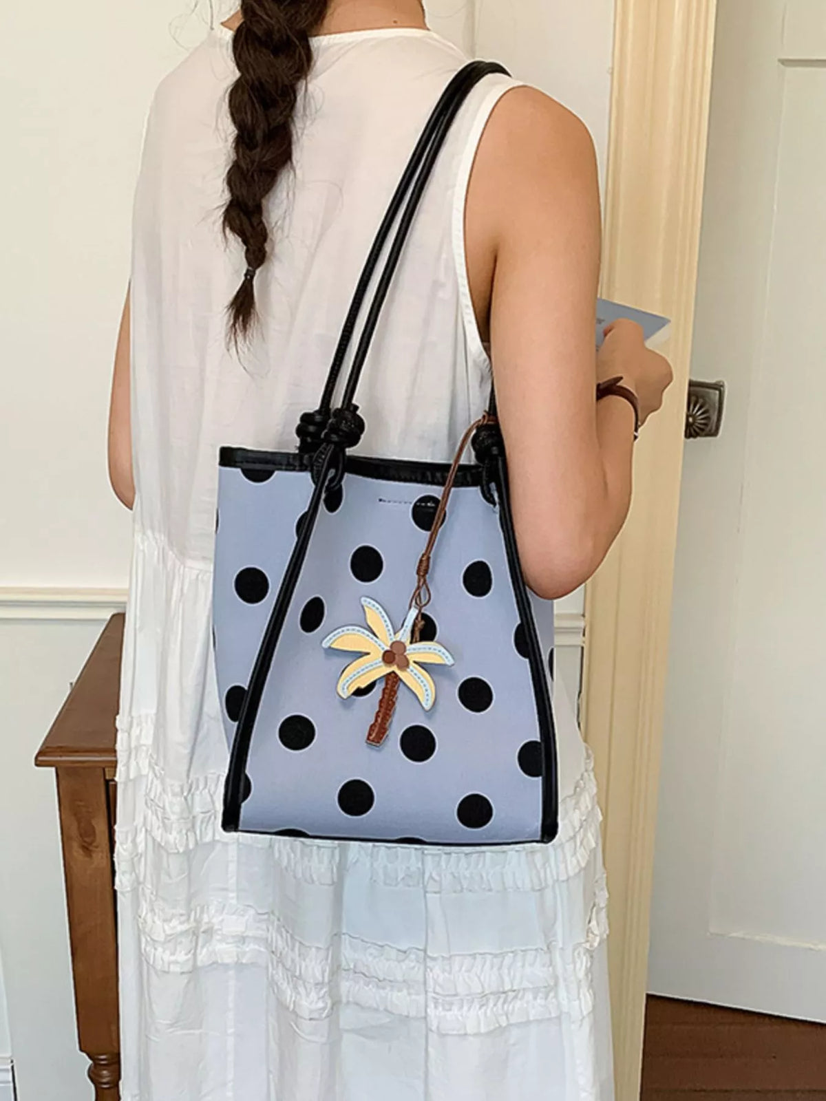 Polka dot shoulder handbag by Plush Fashion Hub with a stylish design and adjustable strap, perfect for casual and everyday use.