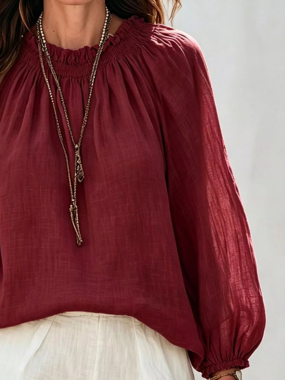 Women’s round neck balloon sleeve blouse by Trendsi, featuring a stylish fit with puffed sleeves and a classic round neckline.