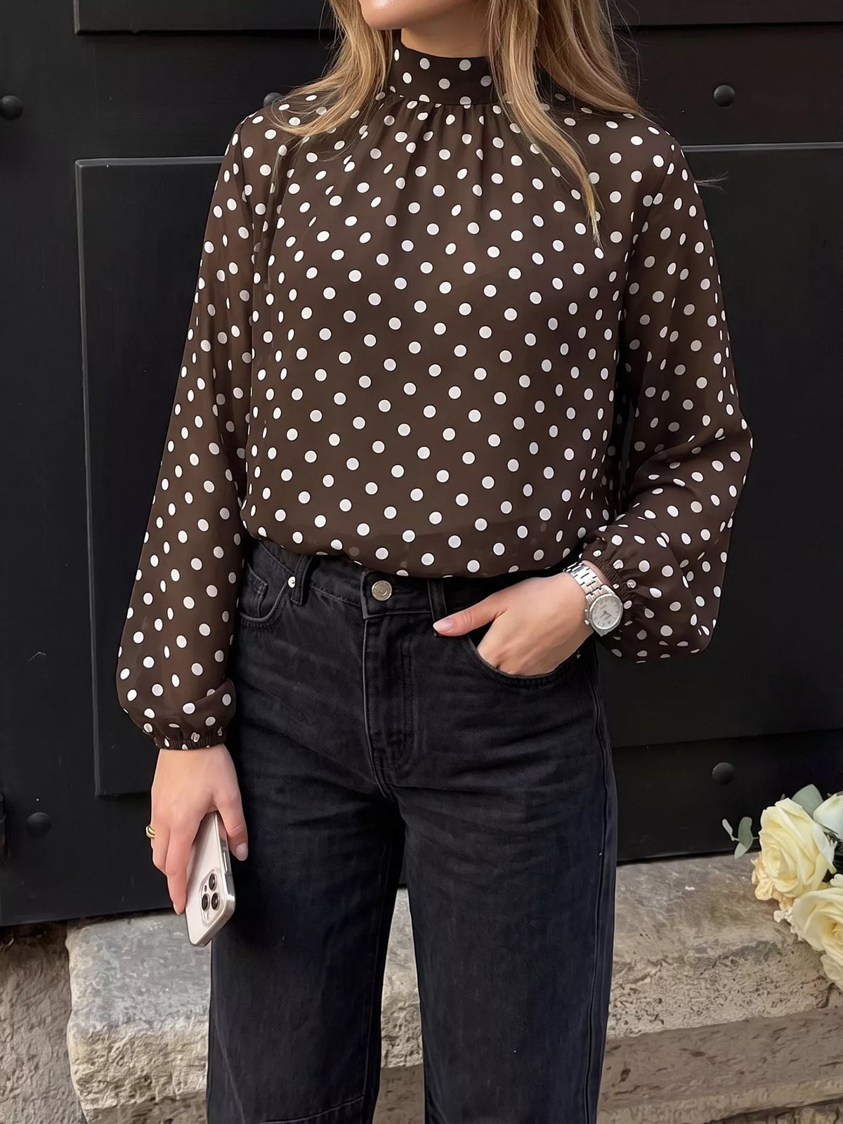 Polka dot mock neck long sleeve blouse from Trendsi, featuring a stylish design with a fitted silhouette and classic pattern.