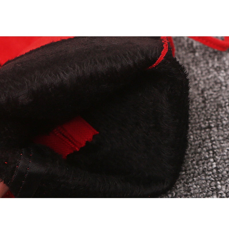 Red snow boot interior lined with thick black faux fur.