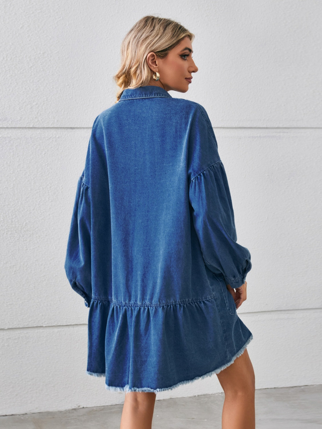 Button-up denim dress with pocket details and raw hem from Plush Fashion Hub, stylish casual clothing for women.