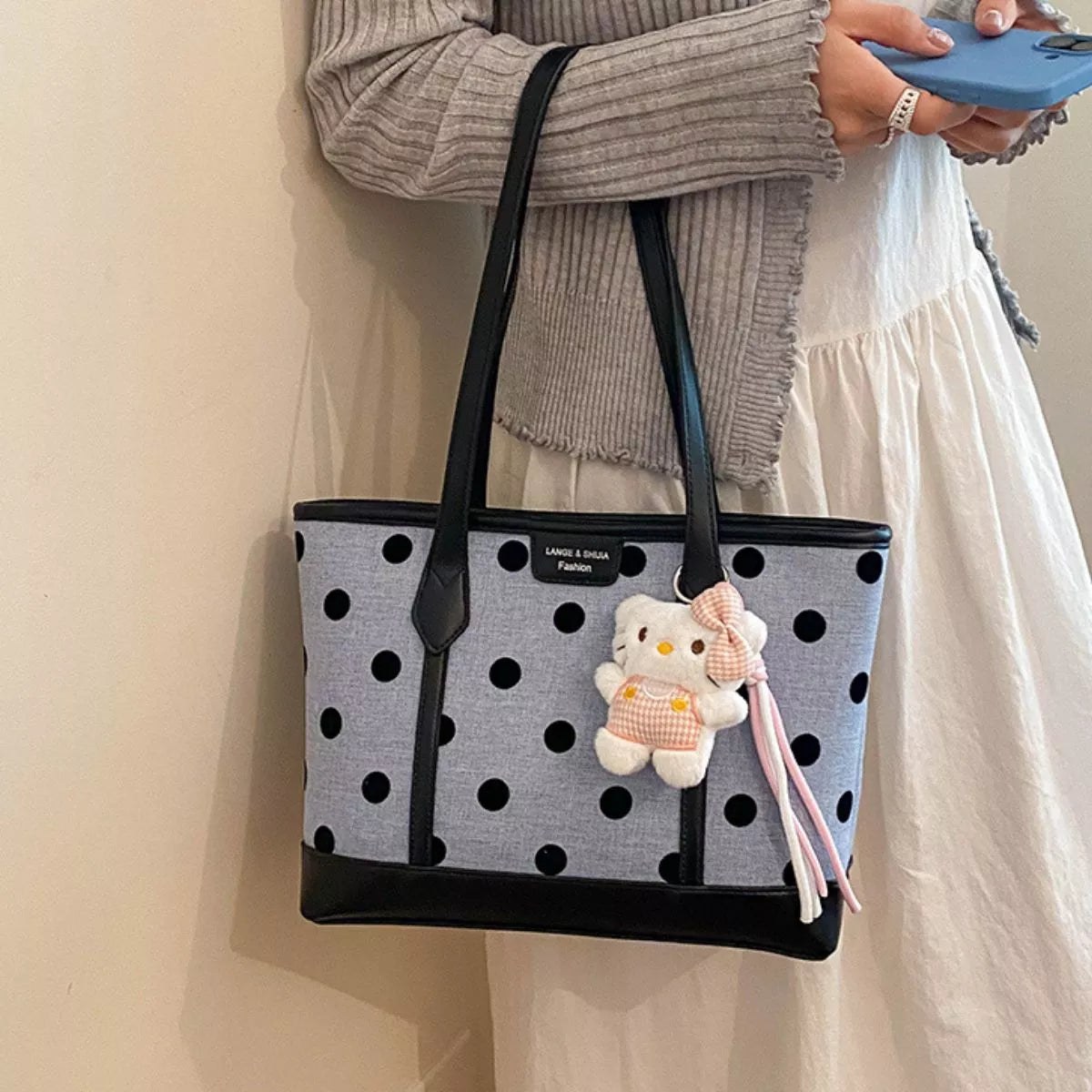 Polka dot women's shoulder handbag with adjustable strap and compact design, trendy Trendsi handbag for everyday use.