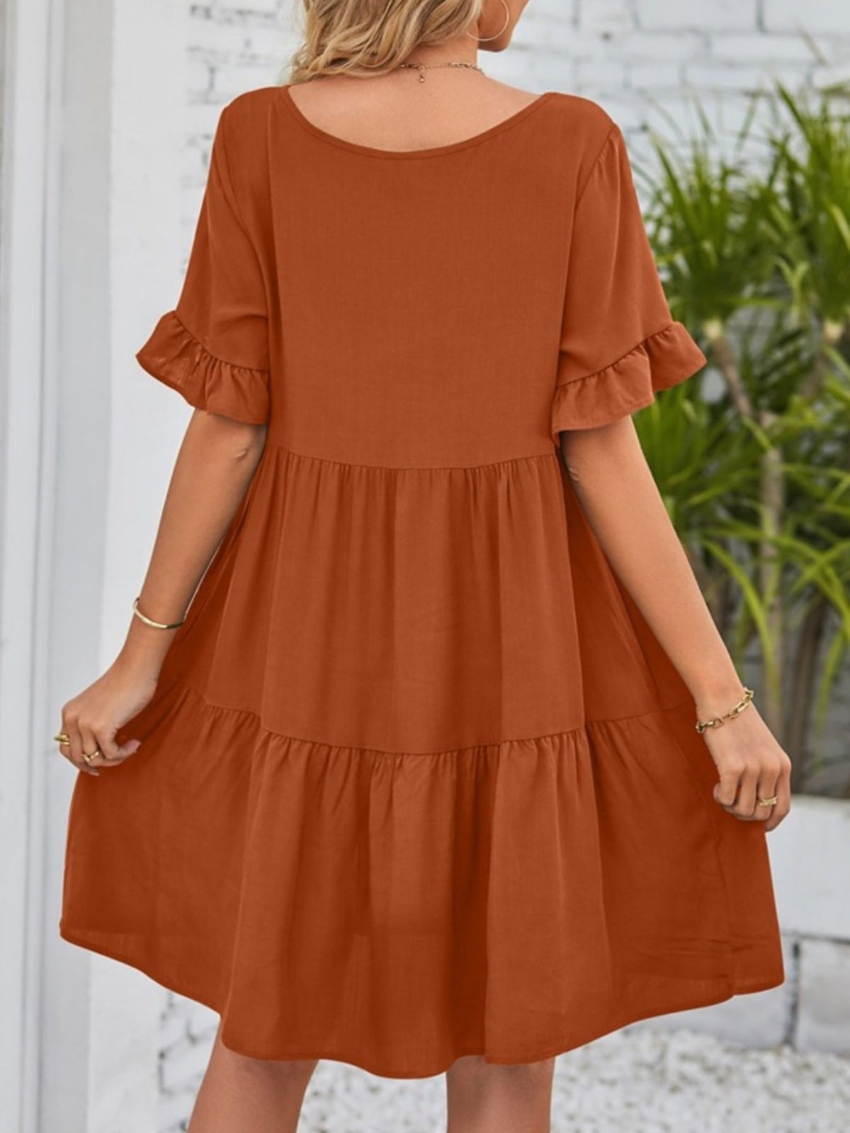 Lightweight rayon mini dress with ruffled sleeves and tiered design featuring pockets from Plush Fashion Hub.