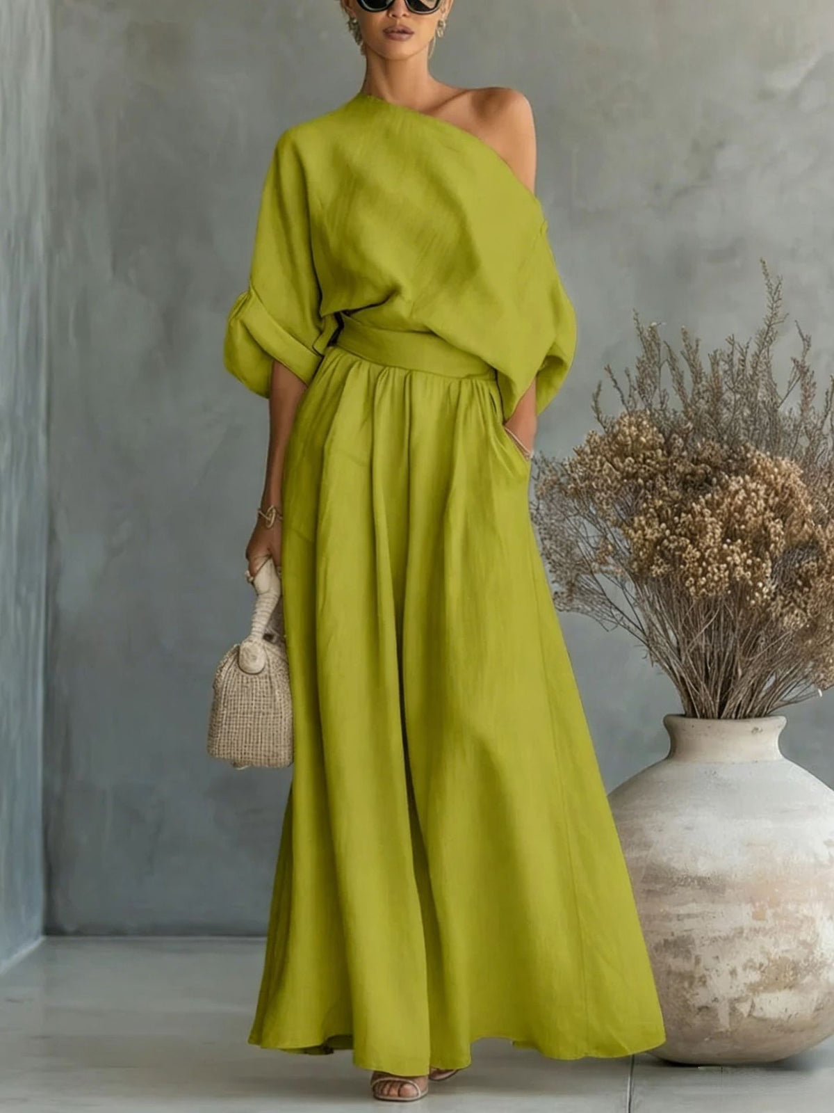 Elegant fitted asymmetrical shoulder top and matching pants two-piece outfit from Plush Fashion Hub, displayed on a model.