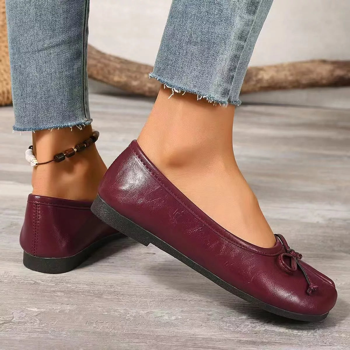 Plush Fashion Hub bow decor split toe slip-on shoes, stylish shoe with bow detail, comfortable slip-on design, in a neutral color.
