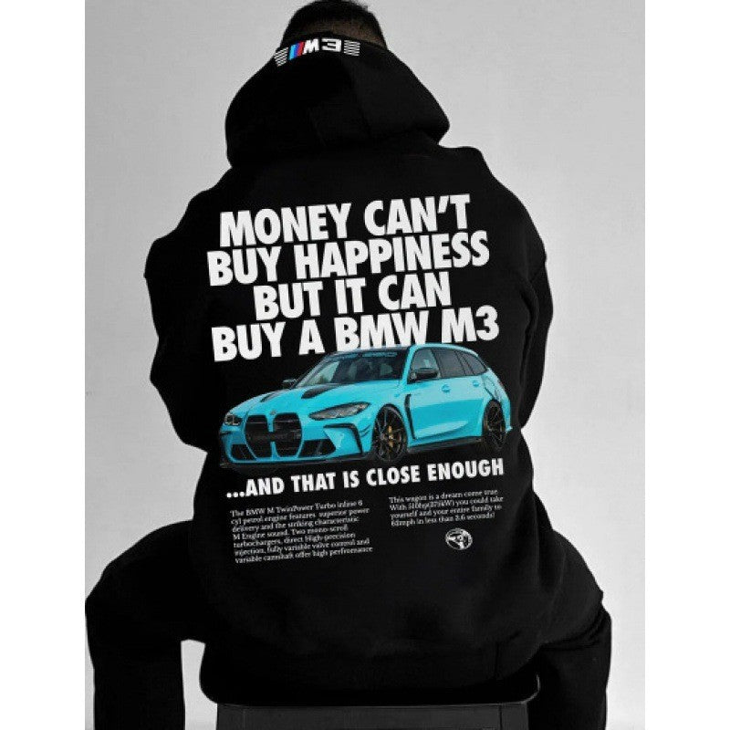 A person from the back wearing a black hoodie with large white text and a blue car graphic.