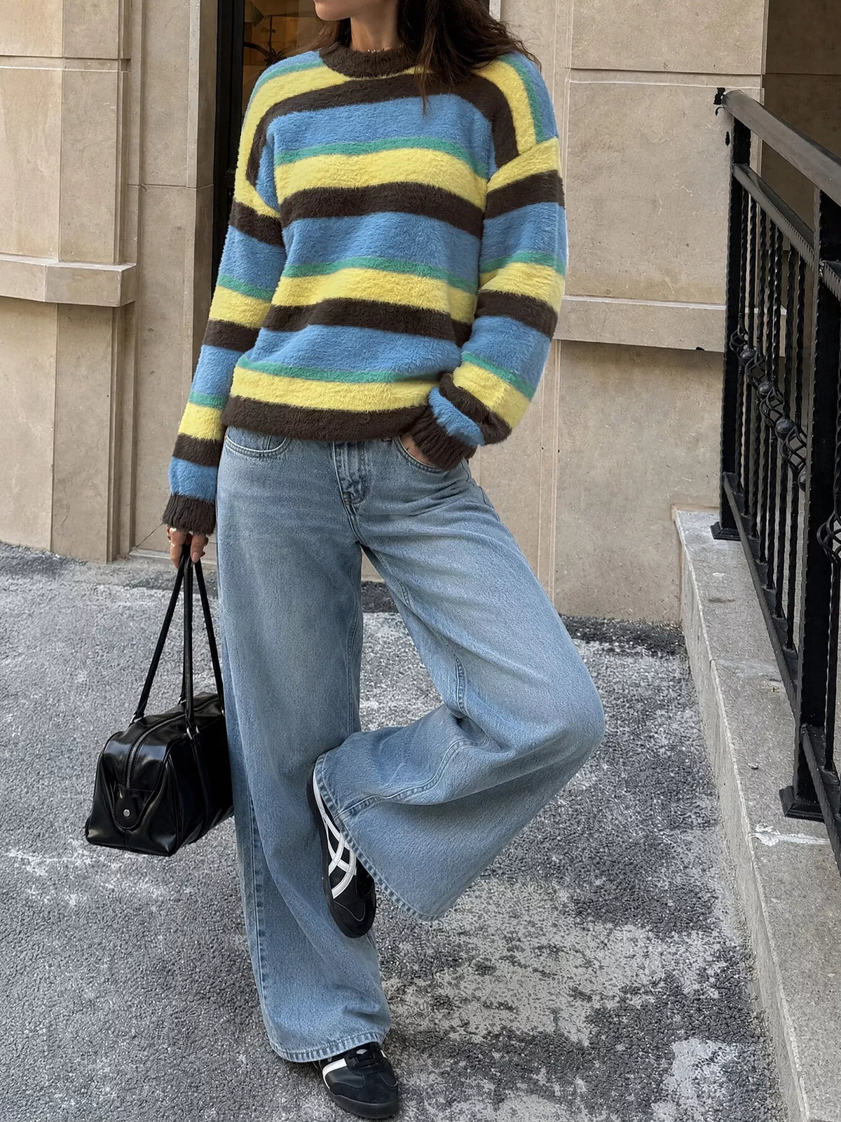 Striped dropped shoulder sweater from Trendsi featuring a relaxed fit and soft knit fabric, perfect for casual wear.