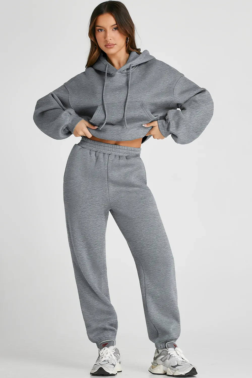 Plush Fashion Hub dropped shoulder hooded top and matching activewear pants set, casual and comfortable for workouts or leisure.