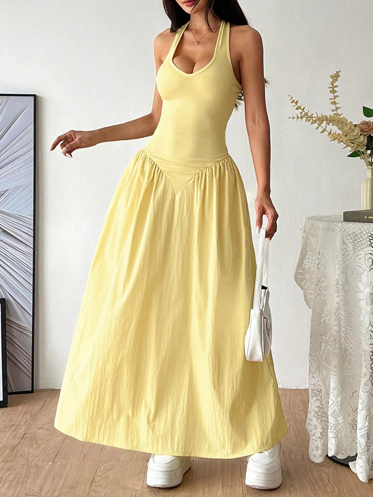 Plush Fashion Hub halter neck ruched maxi dress in flowing fabric with a fitted bodice and elegant design.