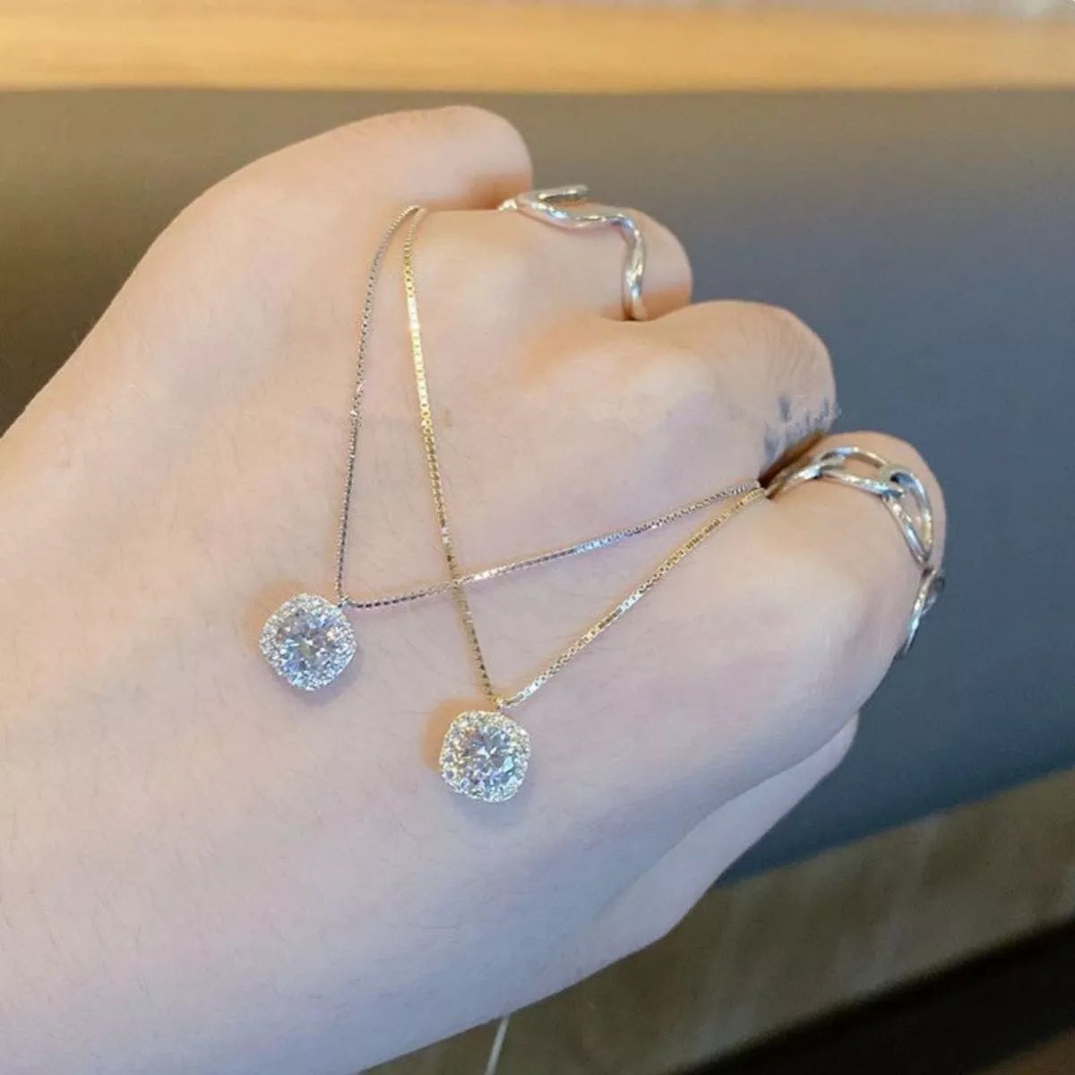 Sterling silver zircon pendant necklace with a sparkling gemstone on a delicate chain, elegant jewelry by Plush Fashion Hub.