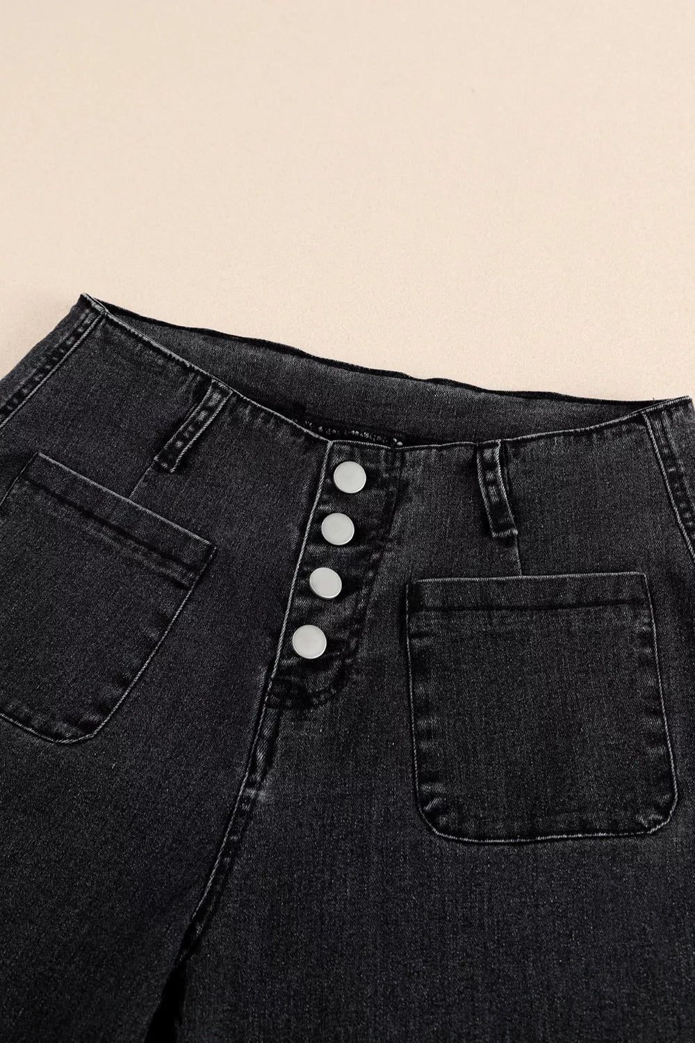 Plush Fashion Hub high-waisted wide-leg jeans with button-fly, showcasing denim fabric and classic style on a neutral background.