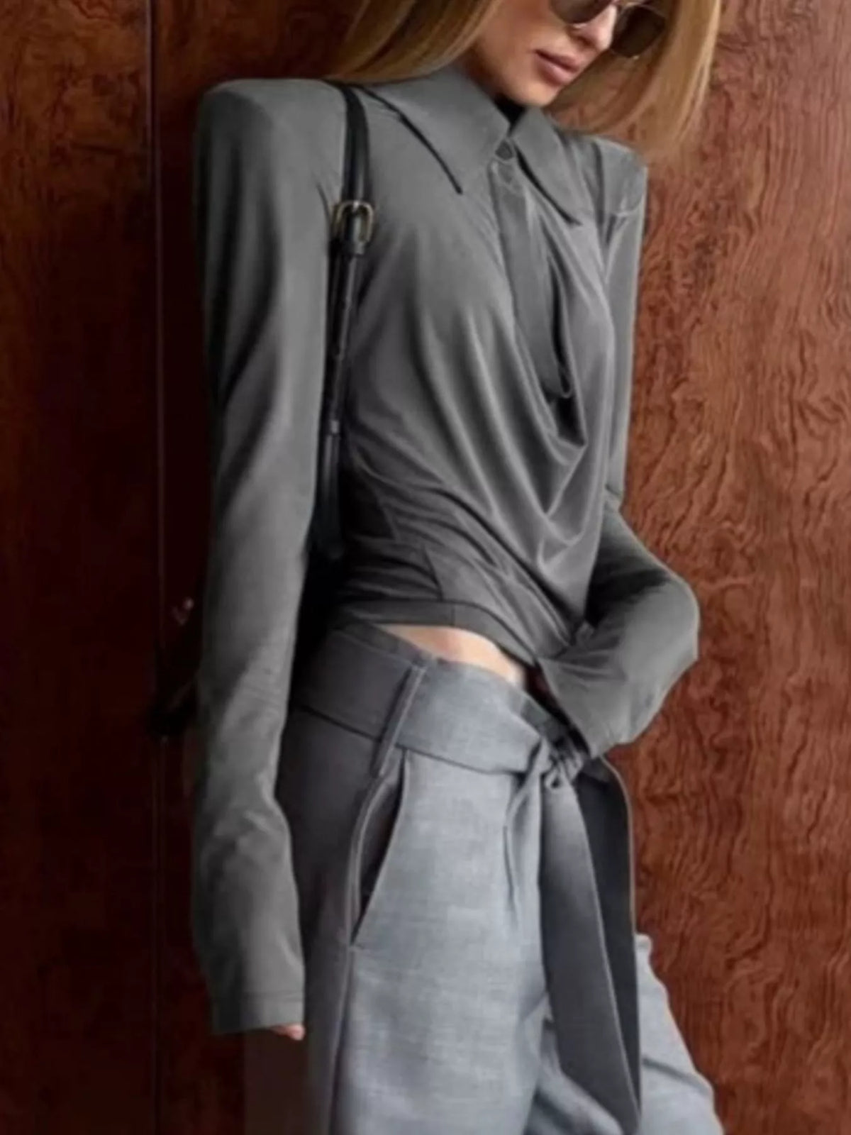 Long-sleeve slim-fit T-shirt with cutout detail by Trendsi, featuring a stylish design and modern silhouette.