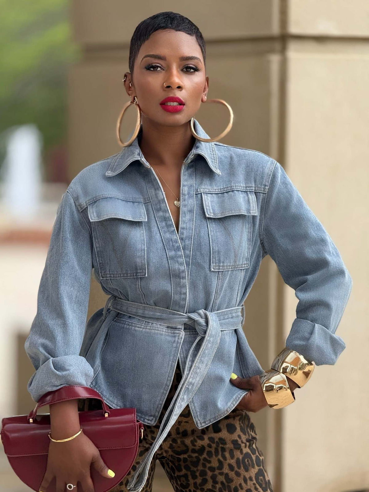 Casual washed denim jacket with pockets and belt by eprolo, featuring a relaxed fit and stylish design.