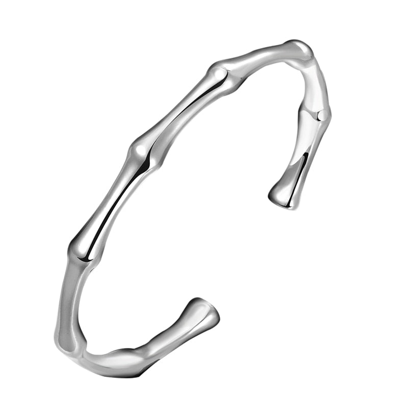 Silver metal cuff bracelet styled as segmented bamboo stalks.