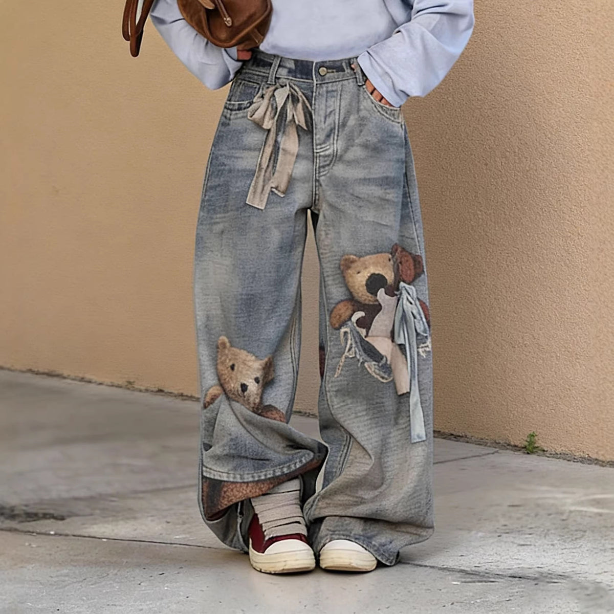 Plush Fashion Hub Bear Bow 3D optical illusion print jeans showing detailed bear bow design on fashionable pants.