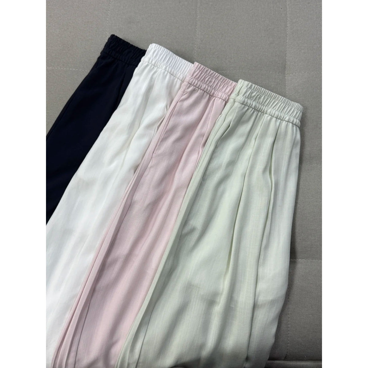 Elegant high-waisted wide-leg trousers for women by eprolo, featuring a flowing fit and stylish design.