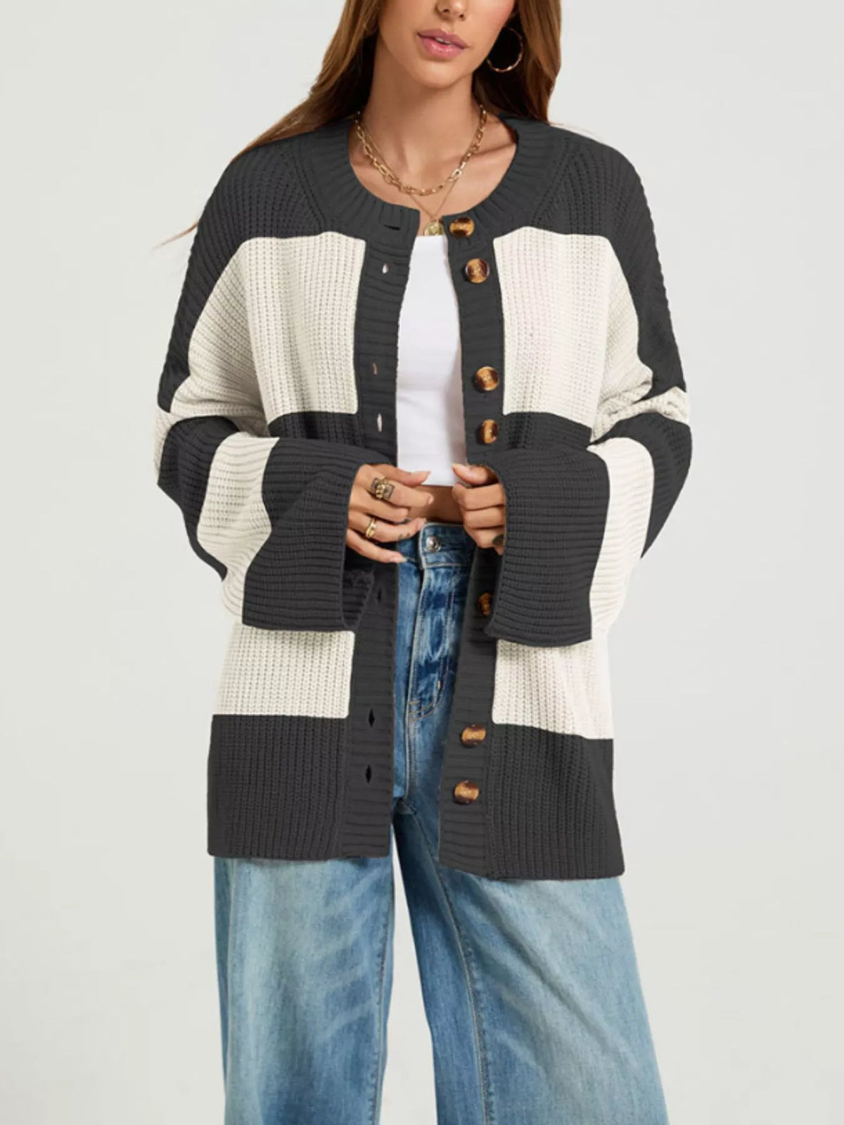 Color block striped button-up cardigan from Trendsi, featuring vibrant color panels and a classic button closure.