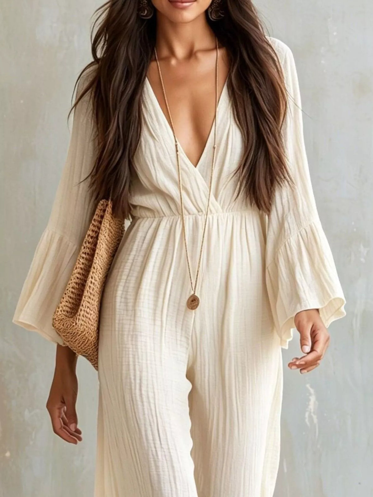Textured flare sleeve women's jumpsuit by Trendsi, featuring a stylish fit and feminine design.