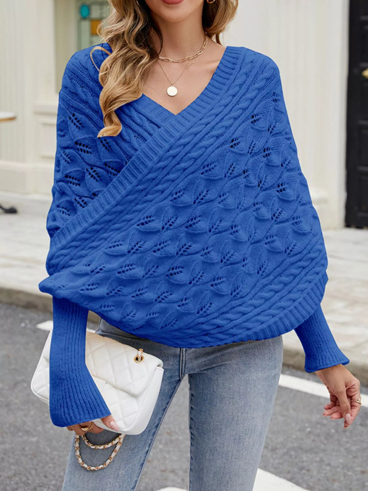 Cable knit batwing sleeve sweater from Plush Fashion Hub, featuring a cozy, textured design with wide sleeves and a relaxed fit.