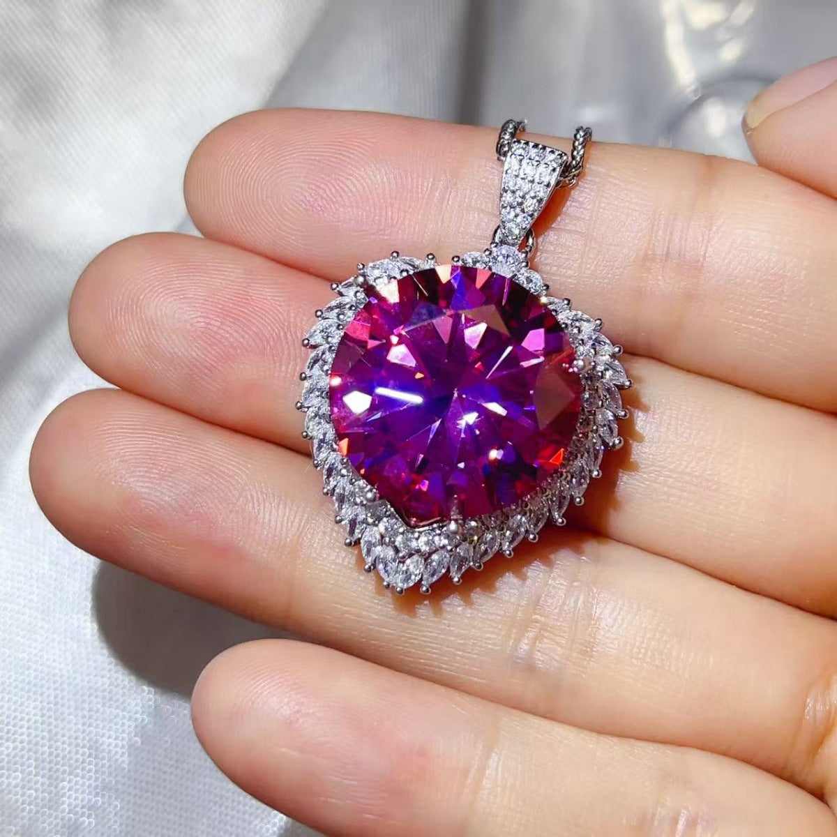 20 carat moissanite pendant necklace in sterling silver, showcasing a sparkling gemstone on a delicate chain.