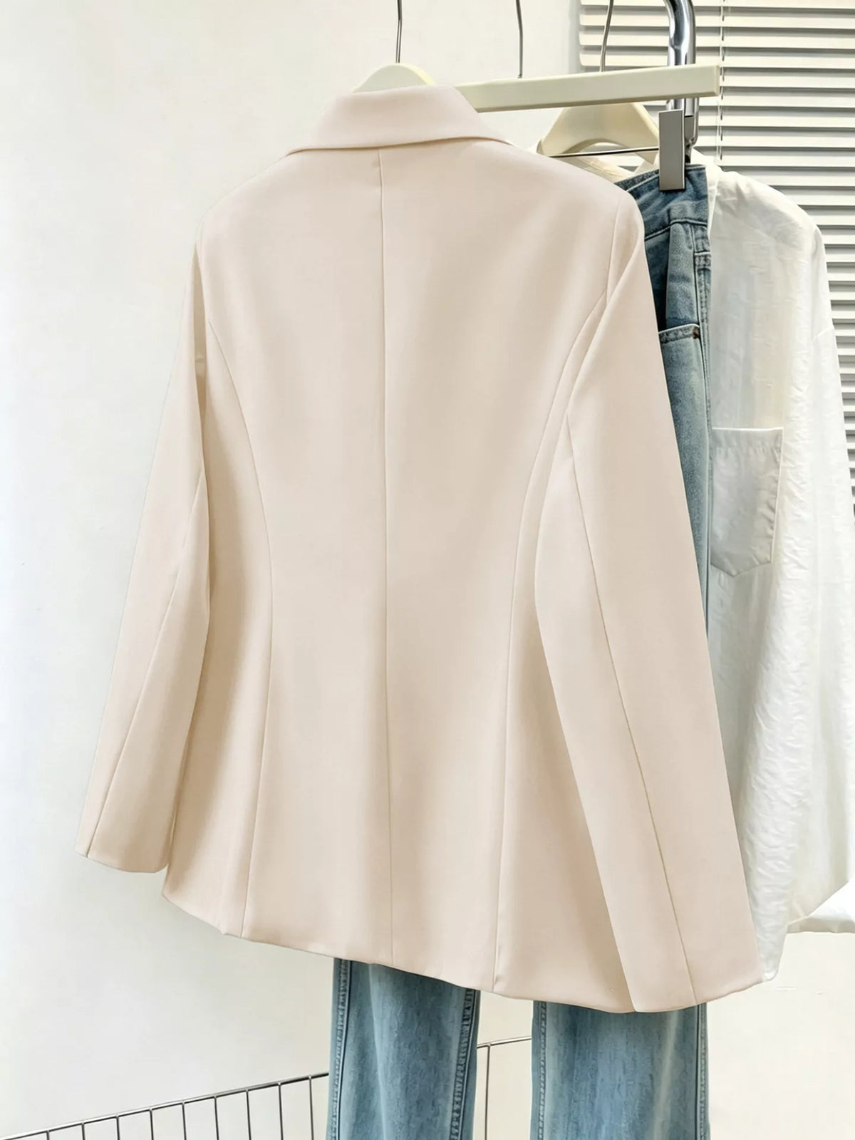Plus size casual blazer with lapel collar, single-breasted design, in a full size, by Trendsi, shown in a stylish, neutral fabric.