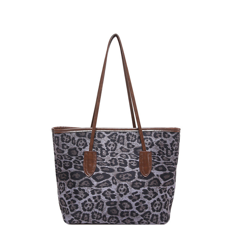 Large-capacity leopard-print PU leather shoulder and hand bag for women, stylish Plush Fashion Hub accessory with spacious interior.