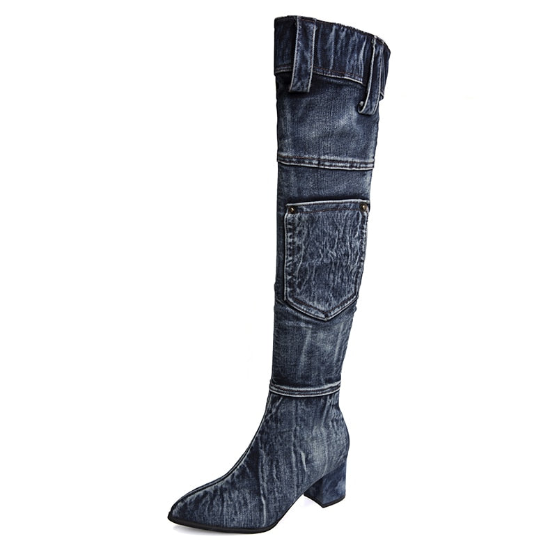 Dark blue denim over-the-knee boot with a pointed toe, block heel, top pocket, and belt loops at the top.