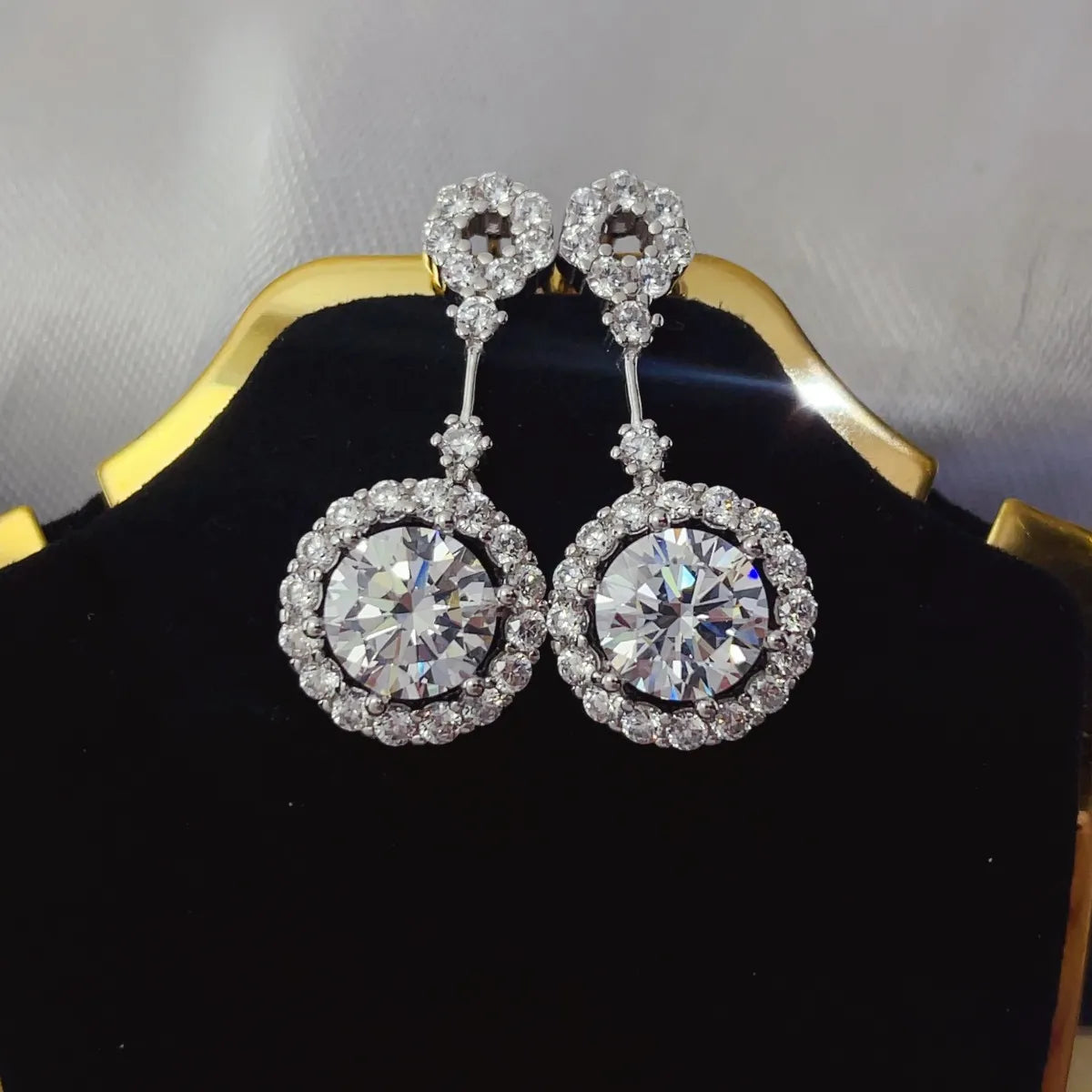 Plush Fashion Hub 4-carat crystal drop earrings with round halo design featuring dangling crystal drops.
