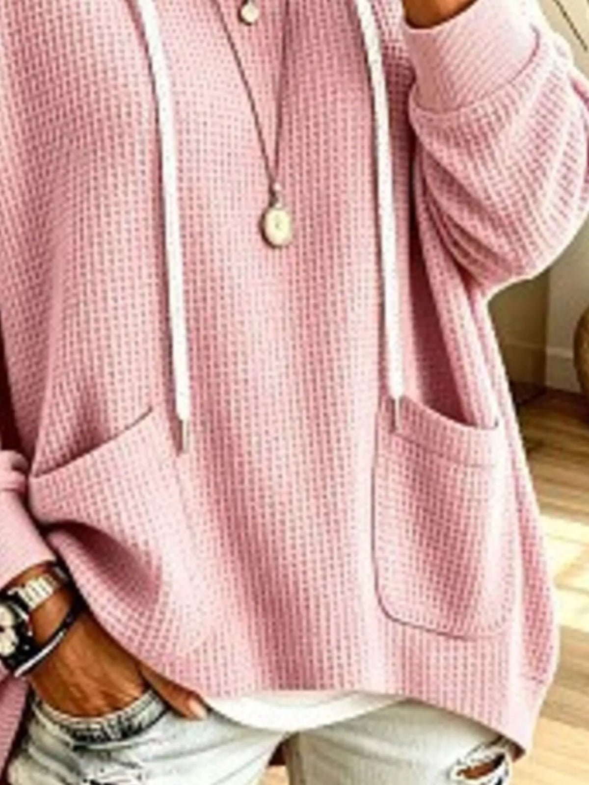 Plus size women's waffle knit hoodie with pockets, casual full size hoodie by Trendsi, shown in soft fabric and relaxed fit.