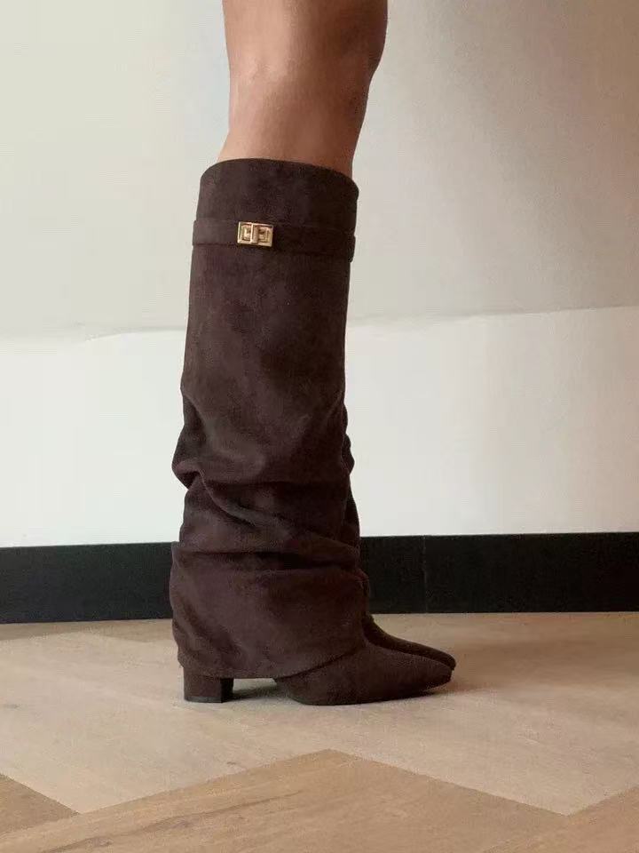 Brown suede knee-high slouch boot featuring a low heel and gold buckle strap detail.