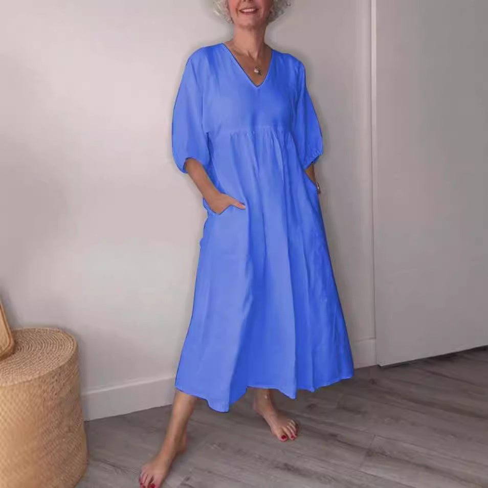 Deep V-neck pleated solid color pocket dress from eprolo, featuring a flattering V-neckline, pleats, and functional pockets.