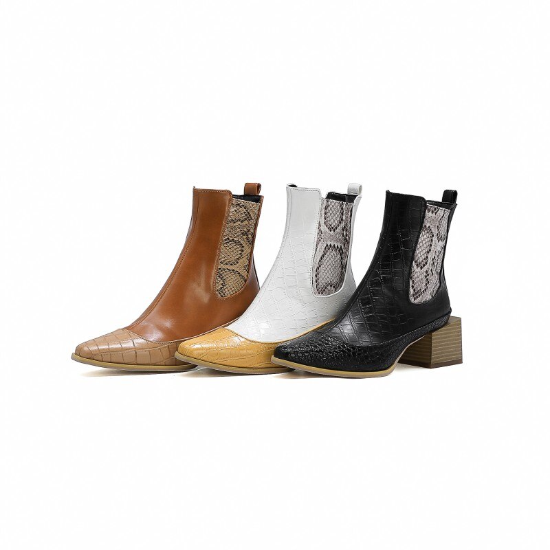 Three ankle boots in brown, white, and black leather with croc-embossed toes, snakeskin elastic sides, and block heels.