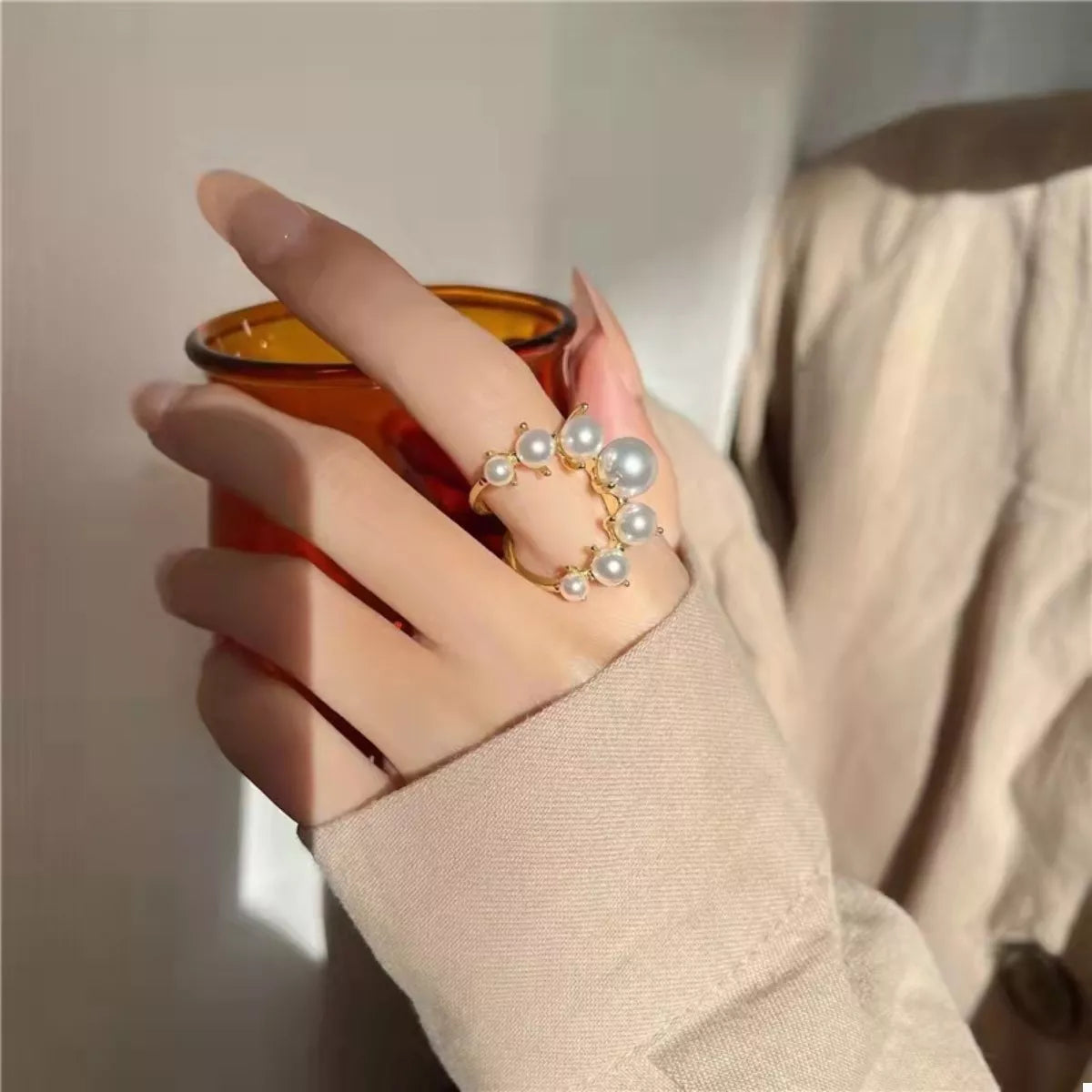 Elegant alloy pearl open ring with a sleek design, featuring a prominent pearl detail, from Plush Fashion Hub.