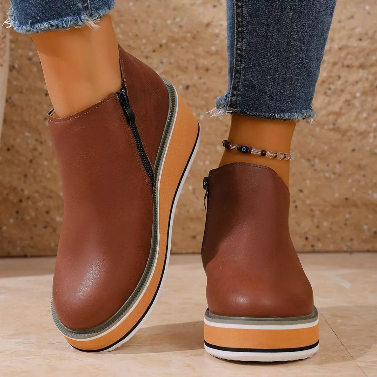 Women's round toe wedge ankle boots by Trendsi featuring a stylish ankle-high design and sturdy wedge heel.
