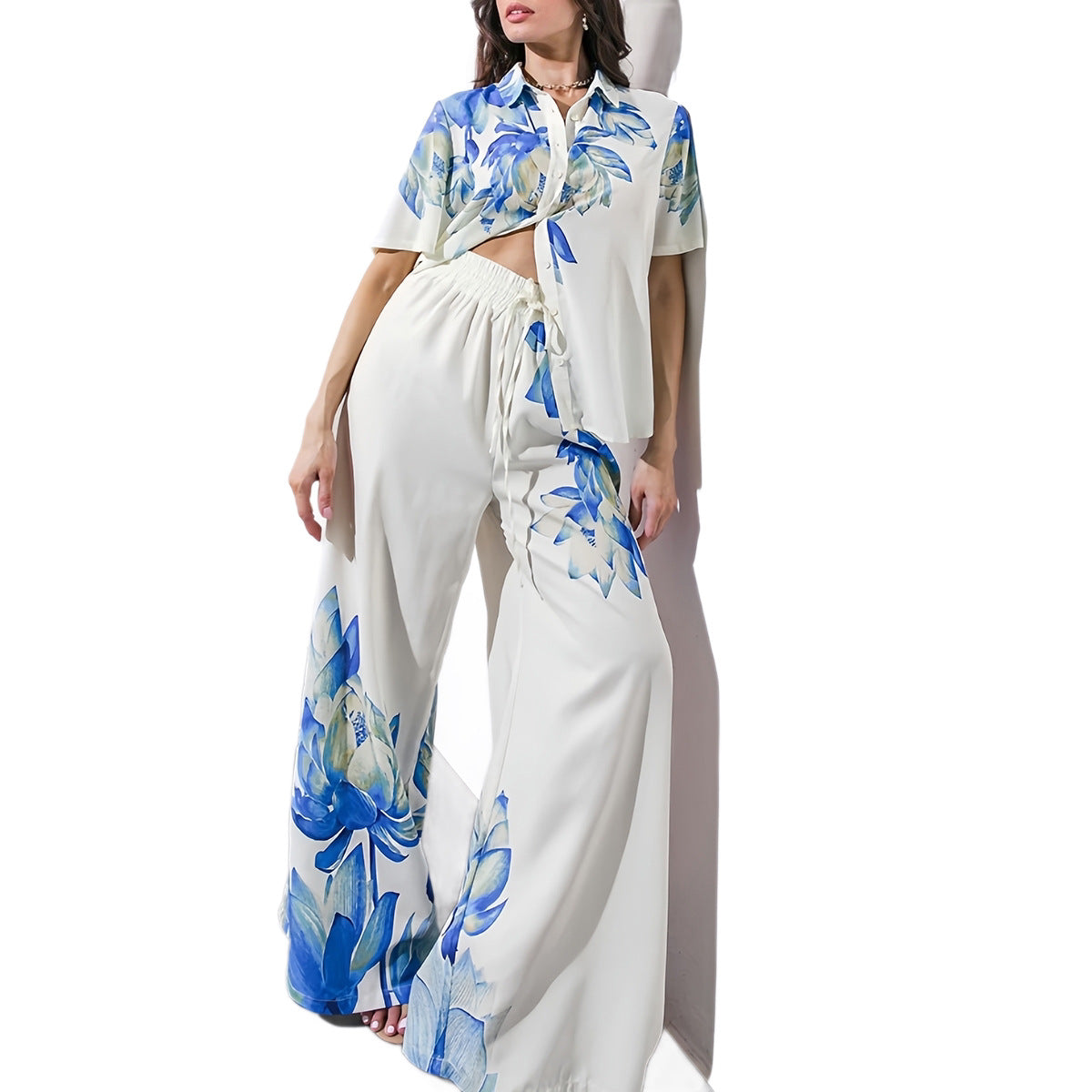 Blue floral two-piece wide-leg pant set featuring a matching top from Plush Fashion Hub, styled for a casual yet chic look.