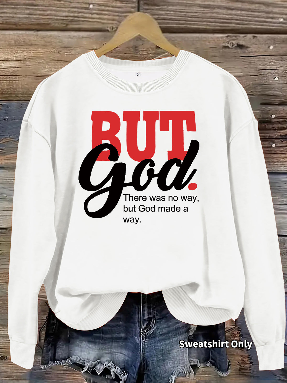 White crewneck sweatshirt with the words "BUT God There was no way, but God made a way." on the front.
