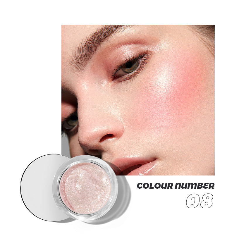 Shimmery pink blush in a glass jar, shown with matching makeup on a woman's cheek and face, labeled Colour Number 08.