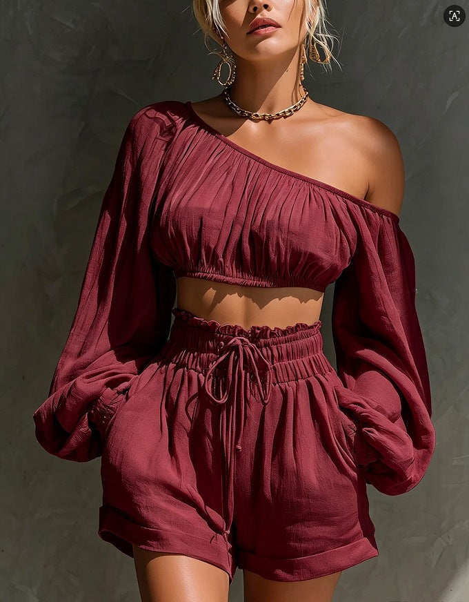 Women’s long-sleeved short top and high-waisted casual shorts set by Plush Fashion Hub, featuring a stylish, coordinated outfit.