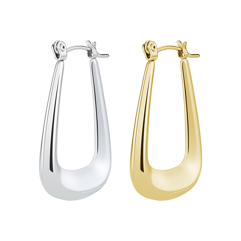 Silver and gold metal U-shaped hoop earrings with hinged clasp closures and thick, tapered silhouettes.