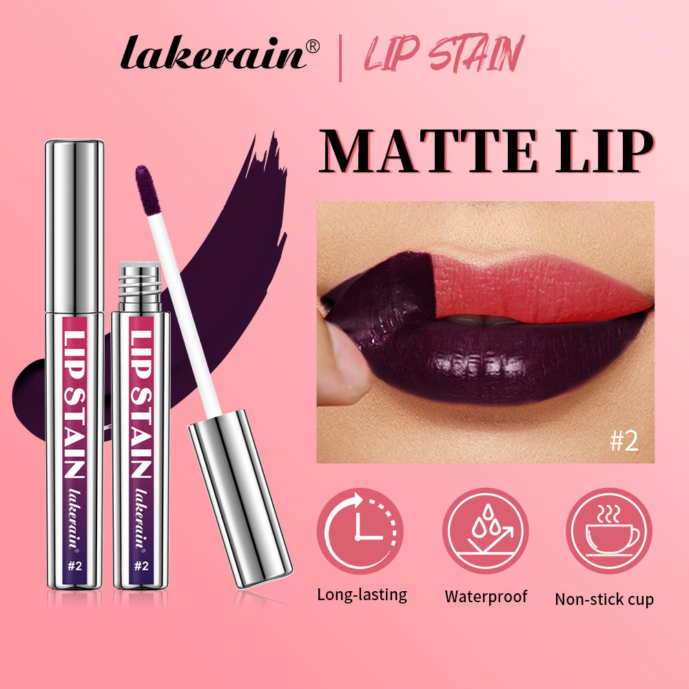 Lakerain dark purple matte lip stain in silver plastic tube with applicator, shown with peel-off tint demonstration.