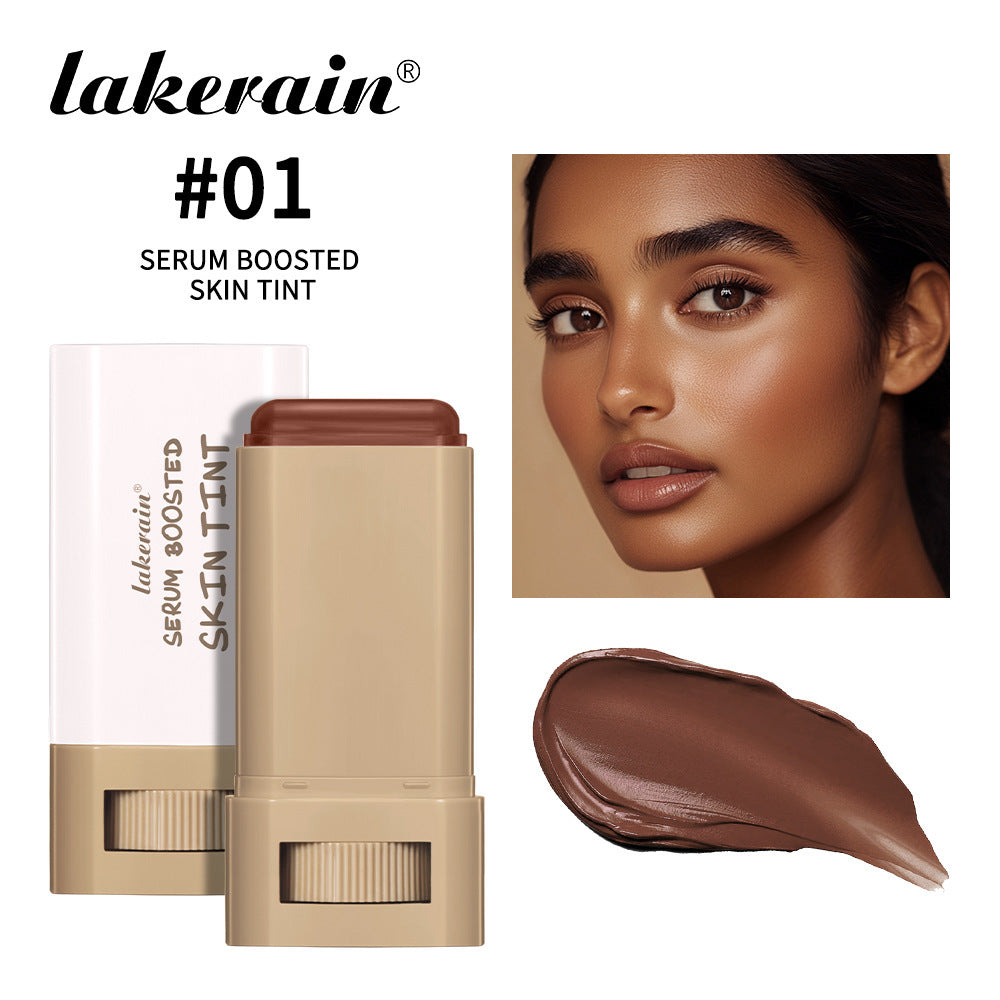 Lakerain Serum Boosted Skin Tint stick in shade #01, with brown tint shown swatched and applied to a model's face.