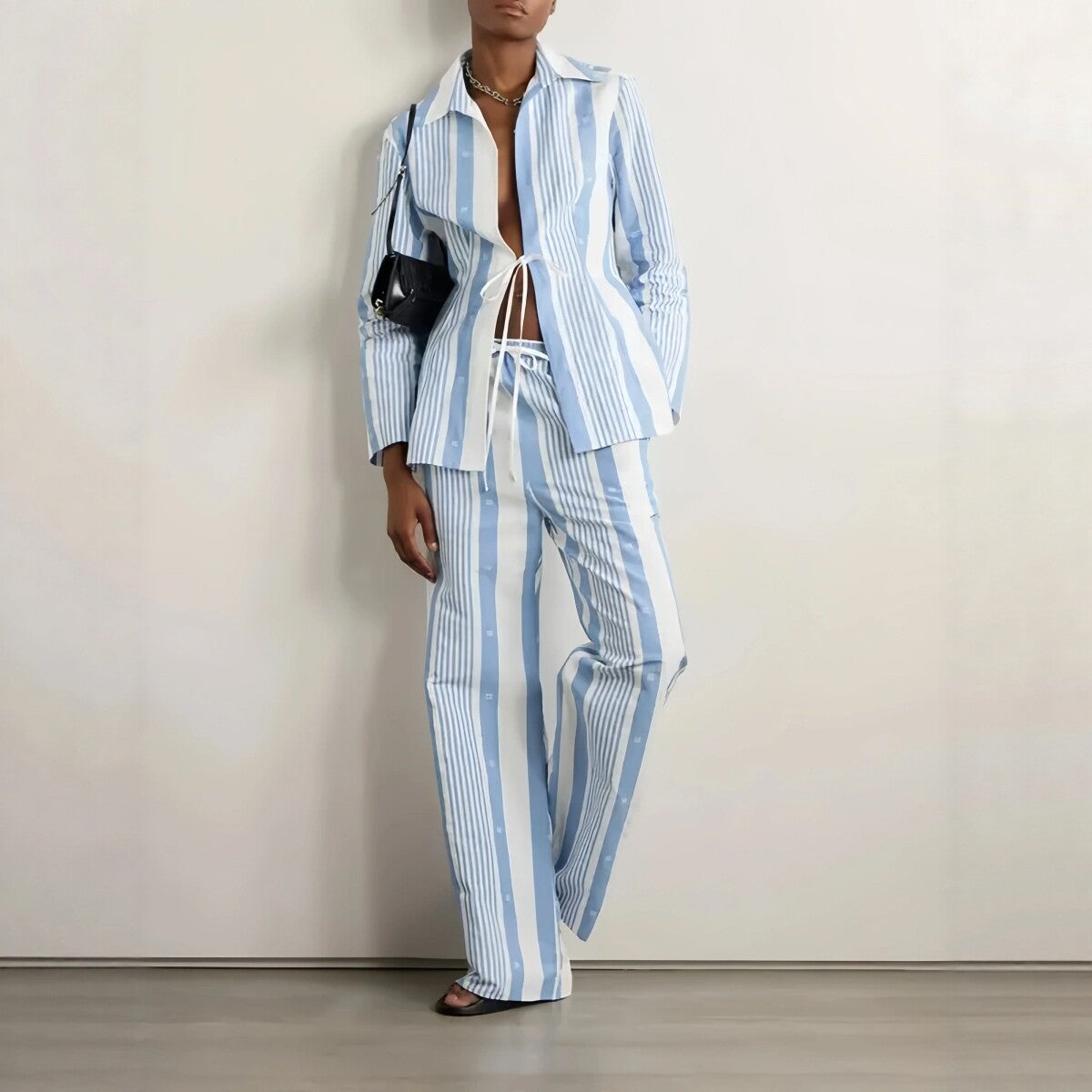 Blue and white striped wide-leg lounge bottoms from Plush Fashion Hub, featuring a comfortable, relaxed fit.