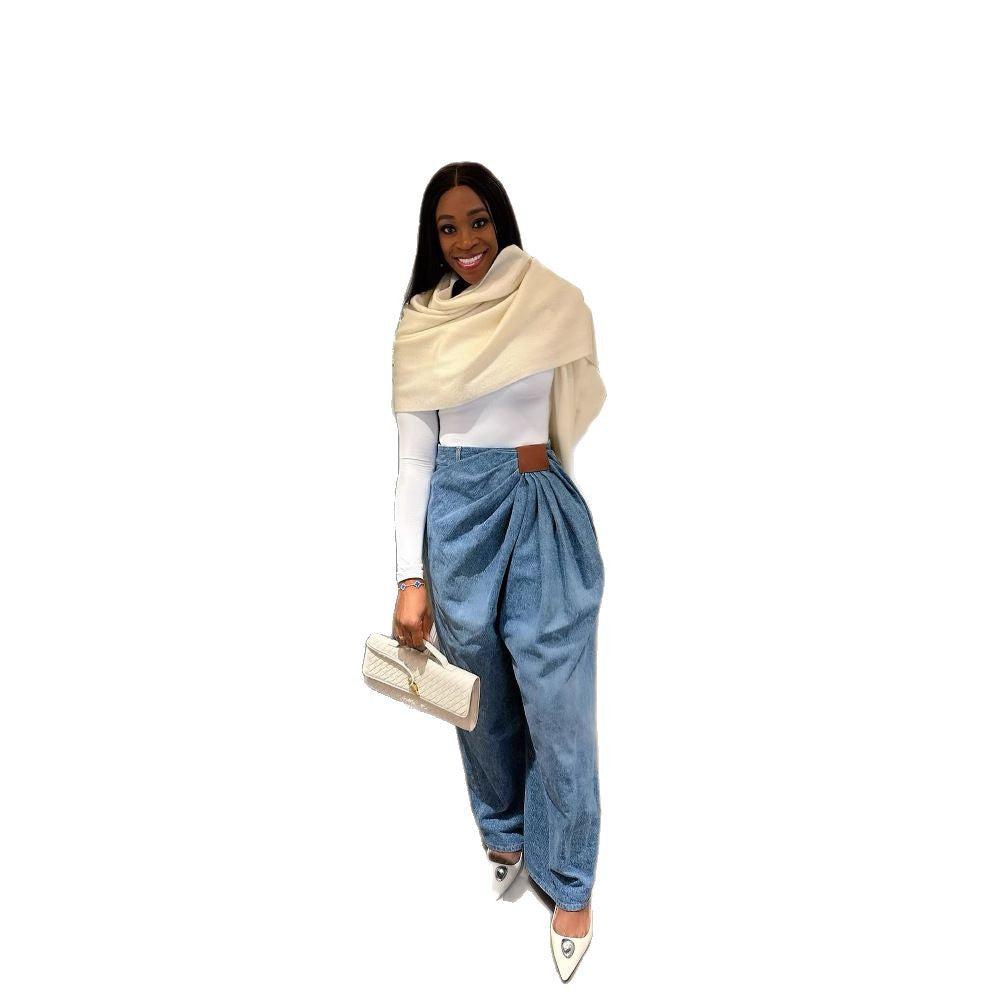 Women’s high-waisted wide-leg washed denim pants by Plush Fashion Hub, shown on a model with a casual urban background.