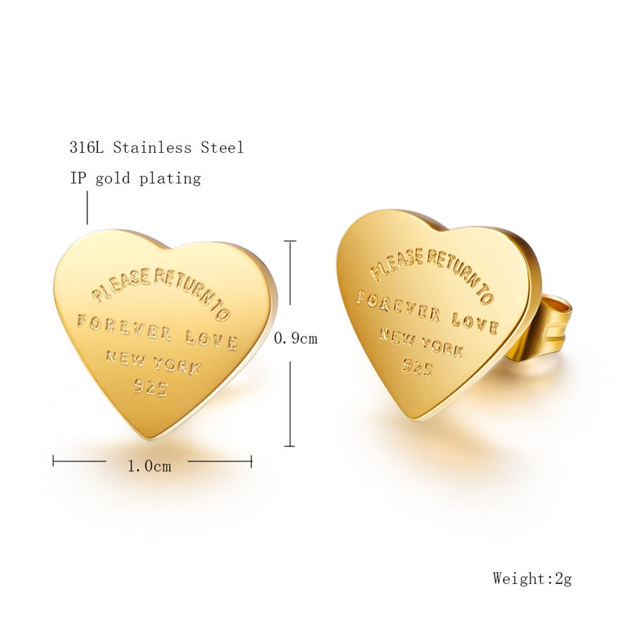 Gold heart-shaped stud earrings engraved with “PLEASE RETURN TO FOREVER LOVE NEW YORK 925”.
