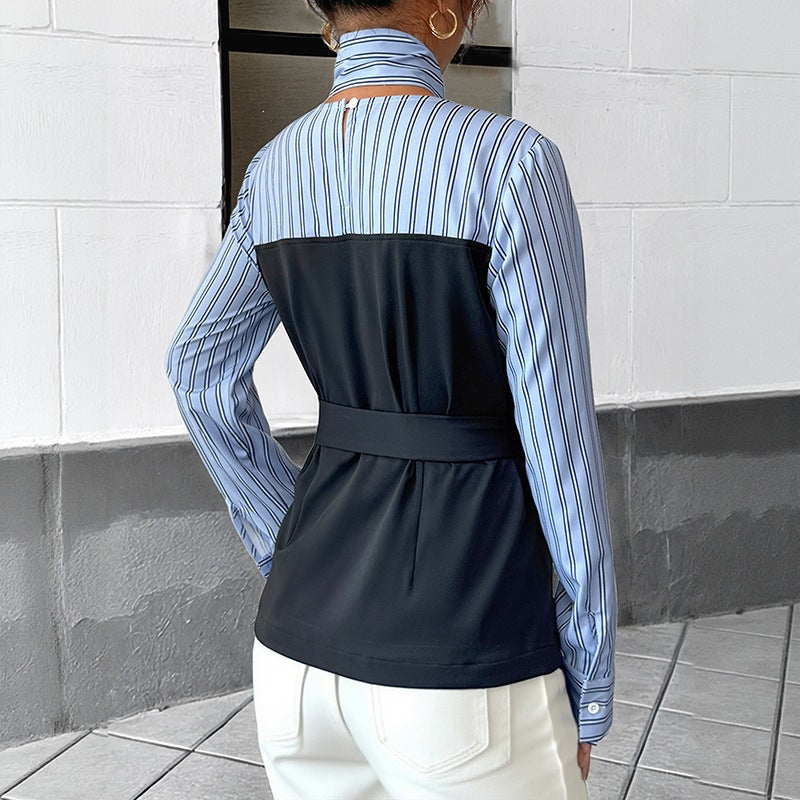 Blue striped and black color-blocked blouse with a choker collar and matching belt.