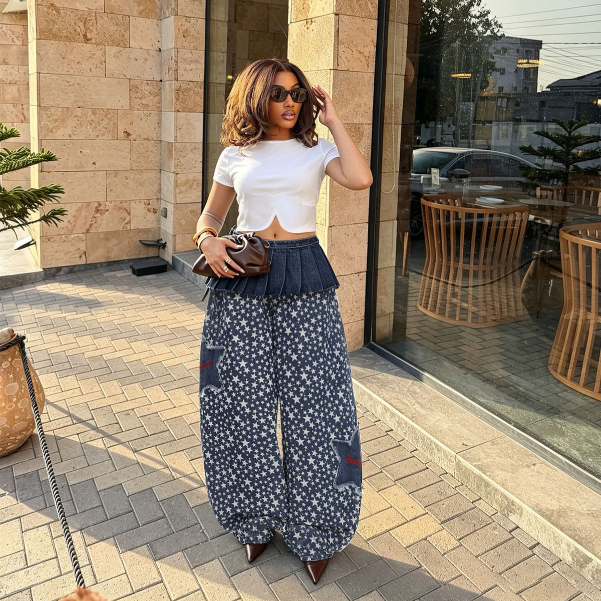 Layered denim pants with star patchwork and removable waist belt from eprolo, showcasing the stylish design and details.
