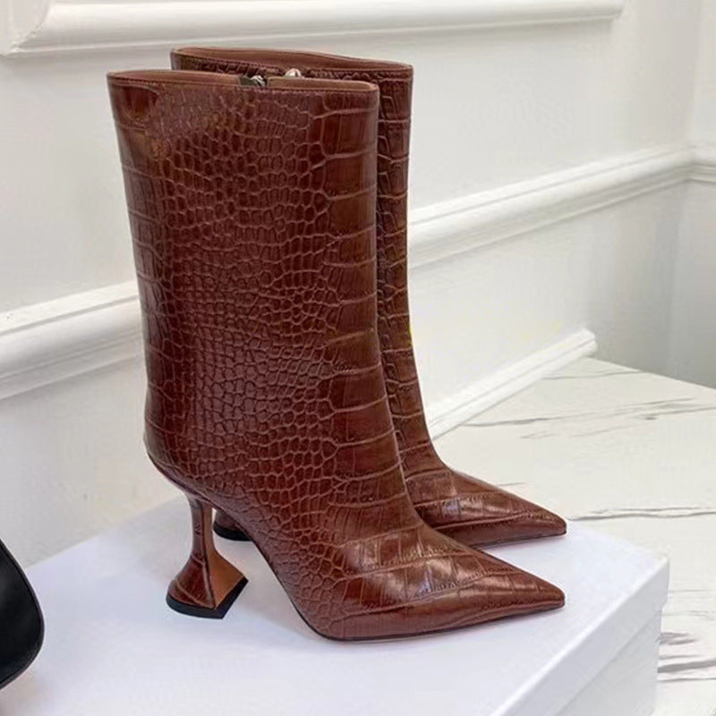 Brown crocodile-embossed leather mid-calf boots with pointed toes and flared stiletto heels.